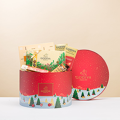 Warm their hearts during the chilly winter days with this exclusive Winter Wonderland round hamper filled with the best Godiva chocolates.